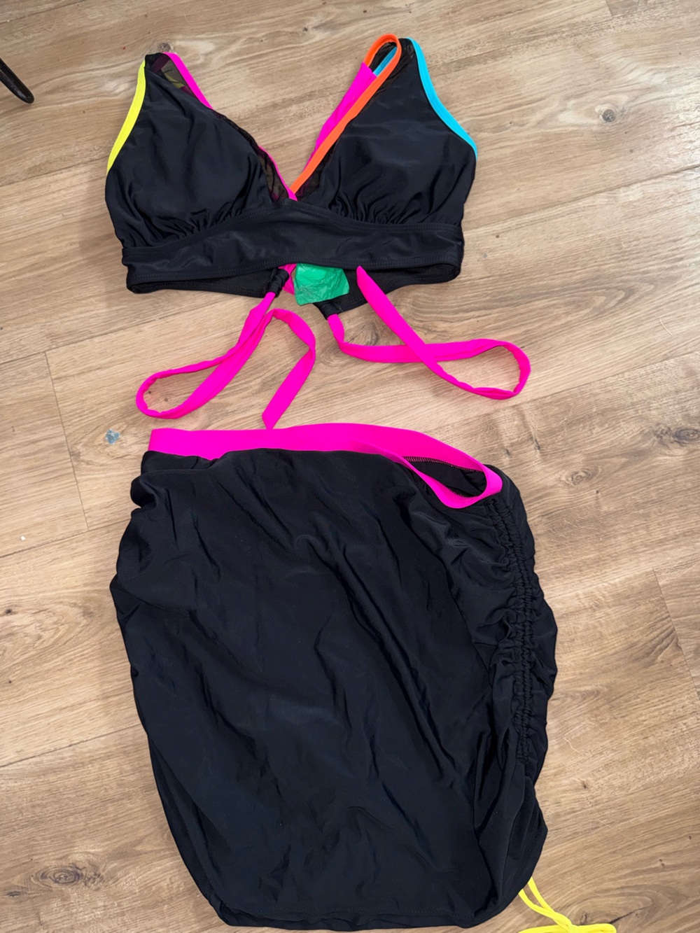 Brand new black and neon bathing suit .